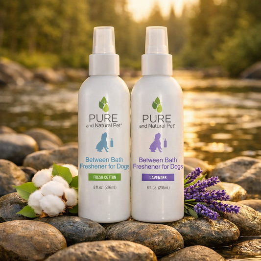 Lavender and Fresh Cotton between-bath dog freshener sprays displayed beside a stream.