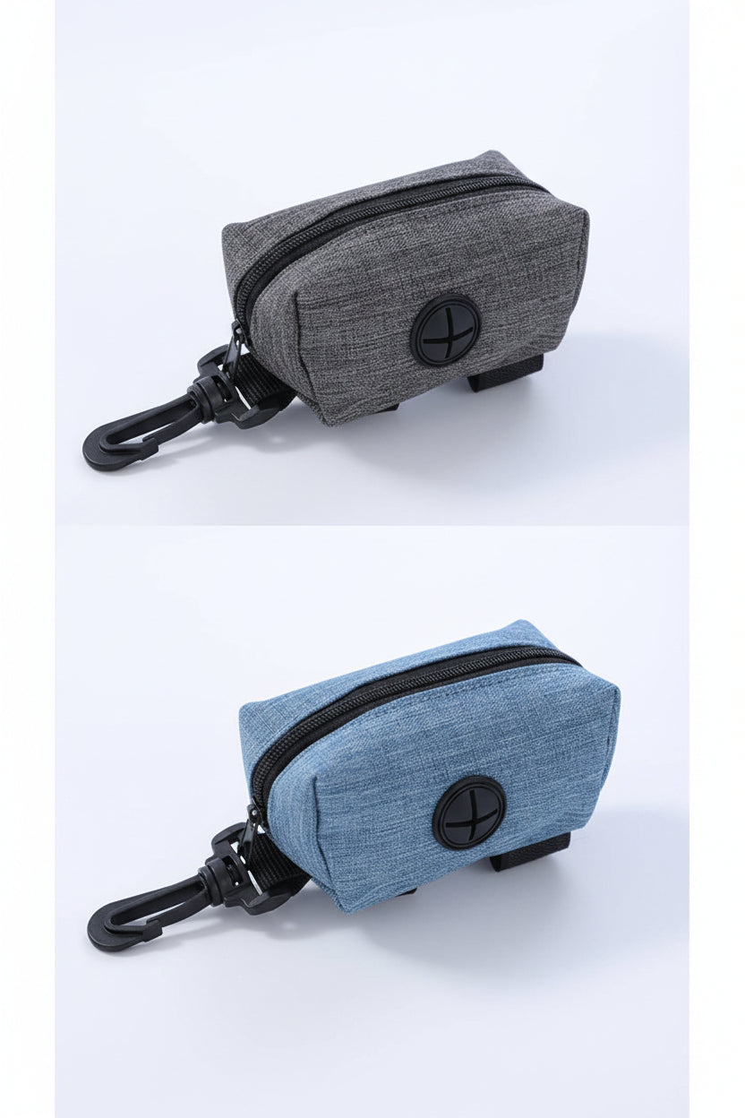 Open light blue zippered dog waste bag dispenser showing a roll of bags inside and a leash clip.